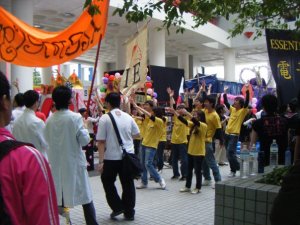 Students from a club performing a choreographed dance to attract new members. Good luck, guys.