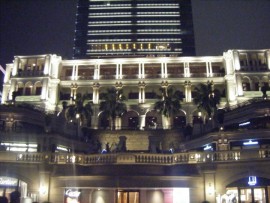 The fancy outdoor mall with the World map on its floor.