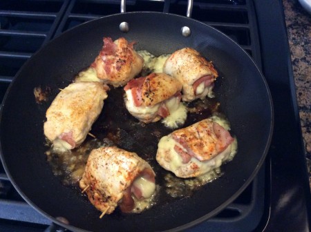 Chicken in the skillet hot out of the oven.