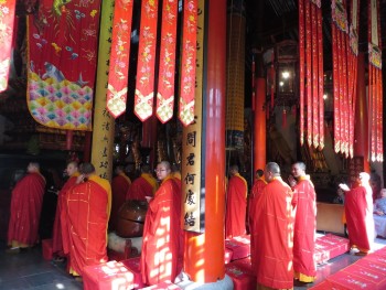 The monks in residence at the Jade Buddha temple in Shanghai praying and chanting.